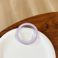 Close-up of a round phone socket stand with dreamy purple glitter on a ceramic plate - Magnetic Base - Ice Crushed - Violet
