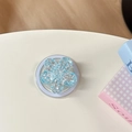 Dettaglio di un supporto per telefono a fiore blu con paillettes luccicanti - Magnetico - Ciliegio con Paillettes ad Alta Lucentezza / Blu