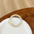 Detail of round phone socket base with glitter inside a ceramic dish on wooden table - Magnetic Base - Ice Crushed - Yellow