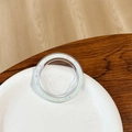 Macro detail of a transparent round phone ring holder with colorful glitter sparkles - Magnetic Base - Ice Crushed - Light Green