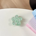 Dettaglio del supporto per telefono a fiore verde chiaro con paillettes scintillanti - Supporto Ciliegio - Paillettes ad Alta Lucentezza / Verde