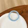 Macro view of round sky blue glitter phone socket on white ceramic plate with wood desk - Magnetic Base - Ice Crushed - Dark Blue