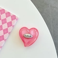 Detail der rosa Glitzer-Herz-Handyhalterung mit handgefertigtem Silberemblem - Ancorra Rot Glitzer