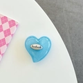 Detail of blue heart-shaped phone grip with a handmade silver metal tag and pearl finish - Blue Flash / Labradorite