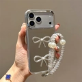 Mirror iPhone case with 3D diamond bows and crystal pearl wrist strap held by model - Plated Mirror + 2 Large Rhinestone Bows + Chain / iPhone 7/8/SE 2020