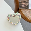 Detailed view of heart-shaped glitter phone socket featuring colorful 3D fruit slices - Brown