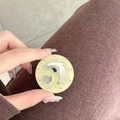 Detailed macro view of heart and dolphin phone grip decorated with sparkling rhinestones - Glitter Dolphin Mirror / Yellow