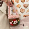 Detail of handmade crochet Christmas bucket bag with plush pink handle and festive ornaments - Brown