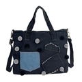 Dunkel schwarze Denim-Tragetasche mit blauem Patchwork und dekorativen Pompons - Schwarz