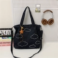 Dark grey denim tote bag with cloud embroidery and star pendant on a white background - With Pendant / Black
