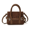 Detail view of brown matte suede mini handbag with leather handles and contrast stitching - Brown