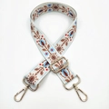 Detail of floral ethnic embroidery strap with golden metal lobster clasps and buckles - White Floral Herb