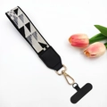 Black and white geometric woven phone strap with gold metal hook and tulip decor - Geometric Triangle With Gasket