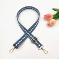 Detail of 2.5cm blue nylon strap with white arrow pattern and gold metal buckles - Blue
