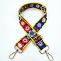 Close-up of wide floral fabric strap with yellow trim and gold metal swivel snap hooks - No. 332 Multicolored Flowers