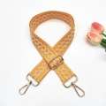 Adjustable orange ethnic embroidered bag strap with golden hooks on white background - Gold Buckle / Yellow