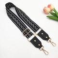 Detail of jacquard embroidered strap with gold rivets and adjustable metal buckle - Gold Buckle / Black