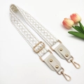 Detail of embroidered jacquard purse strap with gold rivets and metallic hardware - Gold Buckle / White