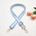 Detail of adjustable blue and white striped bag strap with shiny gold metal hooks - Light Blue Stripes