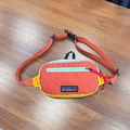 Kids color-block fanny pack in orange, yellow, and blue nylon with adjustable strap - Orange