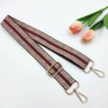 Close-up of wine red ethnic strap with golden sequins and adjustable metal buckle - Gold Buckle / Burgundy