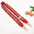 Detail of red and white tweed shoulder strap with gold metal lobster clasps and fringes - Red