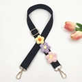 Detail of adjustable black canvas strap with handcrafted crochet floral charms and gold hardware - Gold Clasp / Black Strap With Multi-color Flowers
