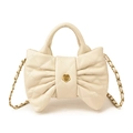 Quilted cream bow handbag with diamond pattern and gold chain strap in variant finish - White