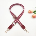 Detail of adjustable burgundy woven strap with white arrow patterns and gold hardware - Gold Buckle / Wine Red + Wine Red Leather