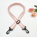 Detailed view of adjustable pink and white striped strap with black plastic swivel hooks - Light Pink + Black Buckle