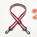 Detail of red and white striped bag strap with adjustable black plastic hooks - Wine Red + Black Buckle