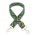 Close-up of adjustable woven shoulder strap with green geometric pattern and gold hardware - Green