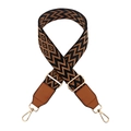 Close-up of adjustable wave pattern bag strap with leather ends and golden metal hardware - Black Brown with Brown Leather