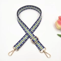 Macro view of colorful geometric woven bag strap with golden metal rotating hooks - Yellow Blue Purple Small V Pattern