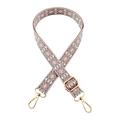 Detail of pink geometric woven shoulder strap with gold metal lobster clasps and buckles - Dusty Pink