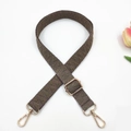 Macro detail of 2.5cm woven bag strap with geometric patterns and gold swivel hooks - Dark Khaki Small V Pattern