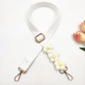 Detail of adjustable white canvas bag strap with 3D handmade knit flowers and gold hooks - Gold Buckle / Pure White