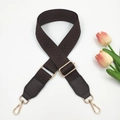 Detail of adjustable dark brown herringbone woven strap with gold metal hardware - Brown