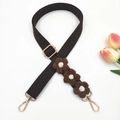 Close-up of brown woven bag strap with handmade crochet white and yellow flowers - Gold Buckle / Brown