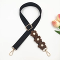 Detail of adjustable black bag strap with crochet flowers and golden metal buckles - Gold Buckle / Black