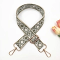 Detail view of ethnic geometric jacquard strap with gold lobster clasps and tulip - Silver Clasp / Beige Army Green