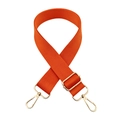 Close-up of vibrant orange wide canvas bag strap with shiny gold metal lobster clasps - Orange