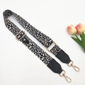 Close-up of leopard print crossbody strap with gold metal buckles and lobster clasps - Beige Black Leopard Single Strap