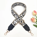 Close-up of bohemian embroidered wide bag strap with black and white leaf pattern - Silver Clasp / Rice Black + Black Leather