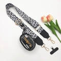 Detail of leopard print crossbody phone strap with gold hardware and mini clear coin purse - White Leopard Black Leather End 3-Piece Set