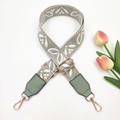 Detail of floral jacquard bag strap with green leather ends and gold metal lobster clasps - Silver Clasp / Rice Bean Green + Bean Green Leather