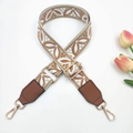 Detail of jacquard embroidered bag strap with floral patterns and gold metal lobster clasps - Rice Light Brown + Brown Leather