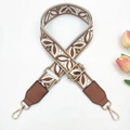 Close-up of bohemian jacquard bag strap with brown leather ends and gold metal hardware - Silver Clasp / Rice Dark Brown + Brown Leather