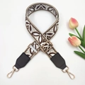 Close-up of ethnic jacquard purse strap with floral embroidery and golden metal buckles - Rice Light Coffee + Coffee Leather