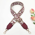 Detail of burgundy ethnic jacquard strap with leaf pattern and golden metal buckles - Rice Wine Red + Wine Red Leather